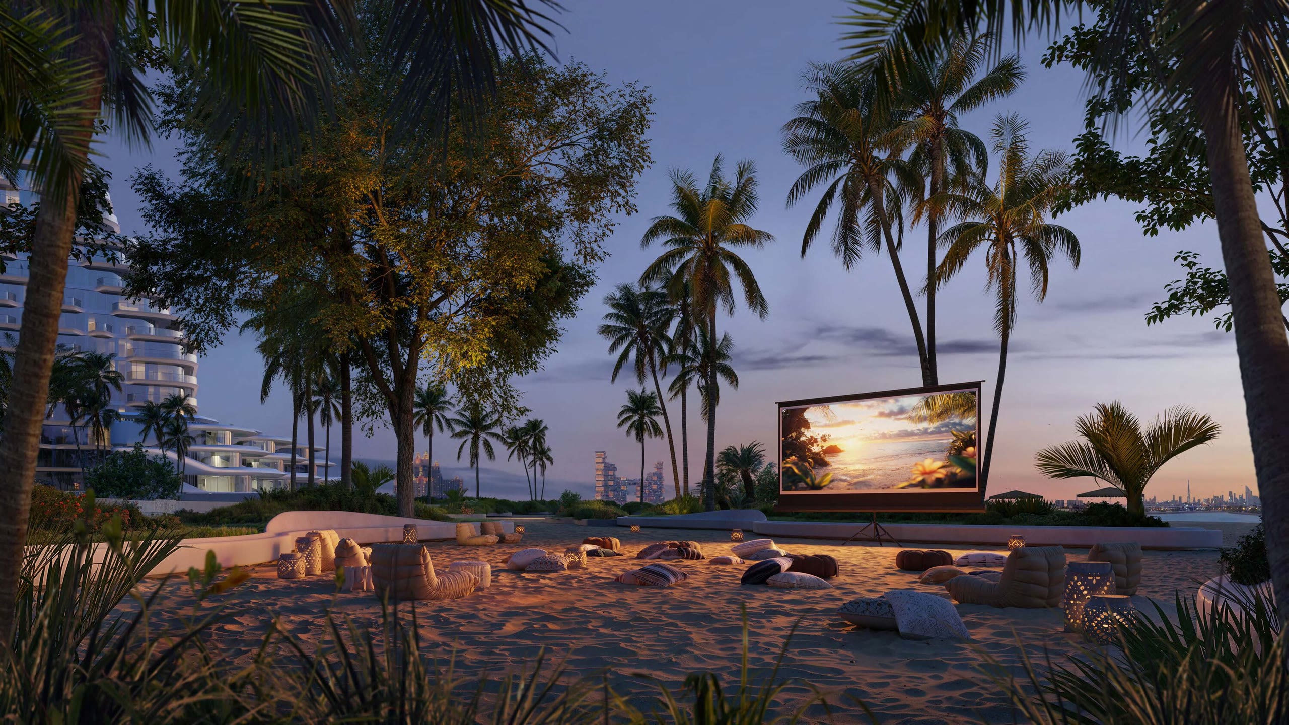 Passo by Beyond beach at dusk with an open-air cinema screen, palms and the residences behind